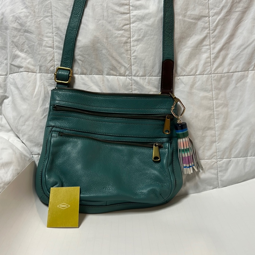 Fossil leather crossbody Explorer Bag in a greenish turquoise